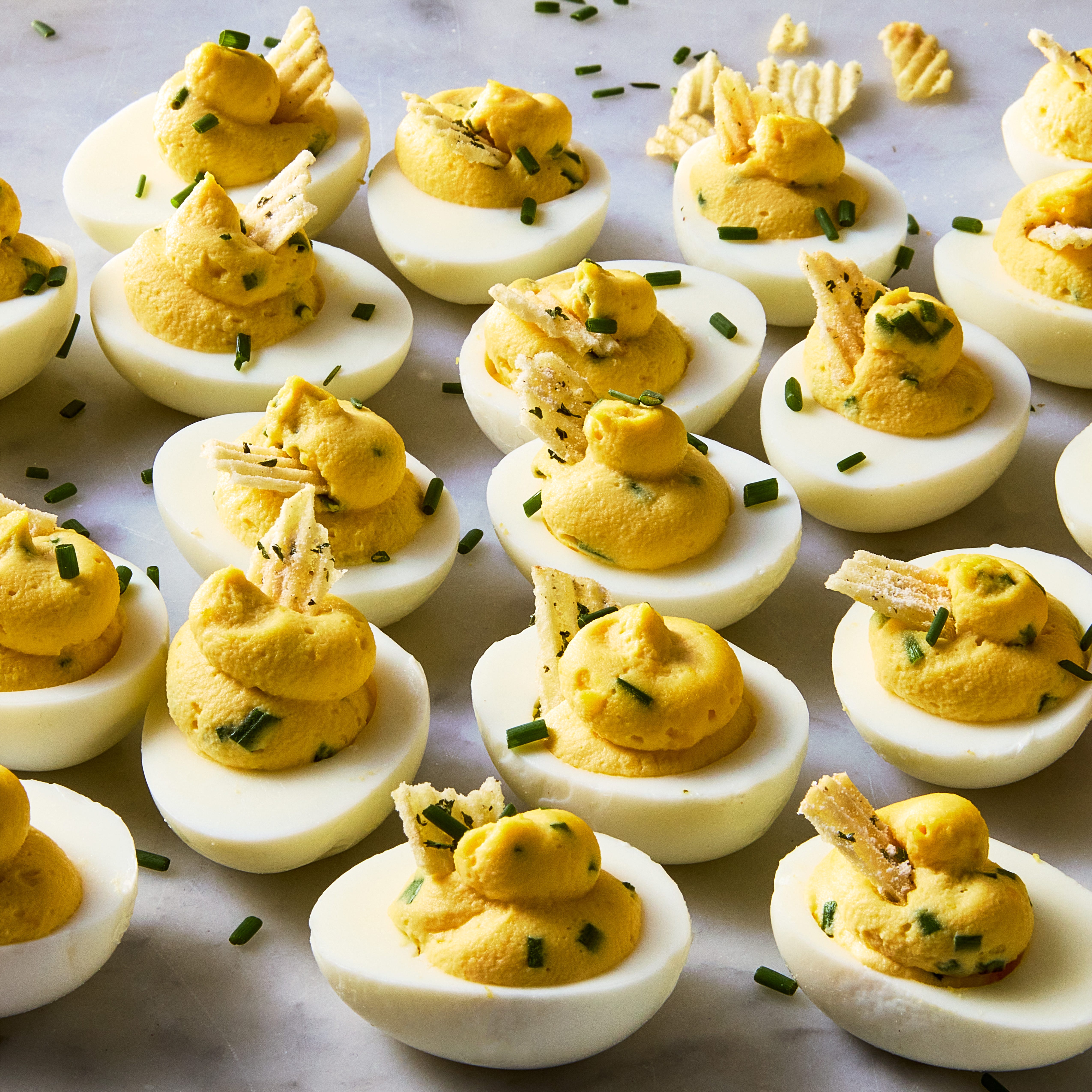 deviled eggs with sour cream and onion chips