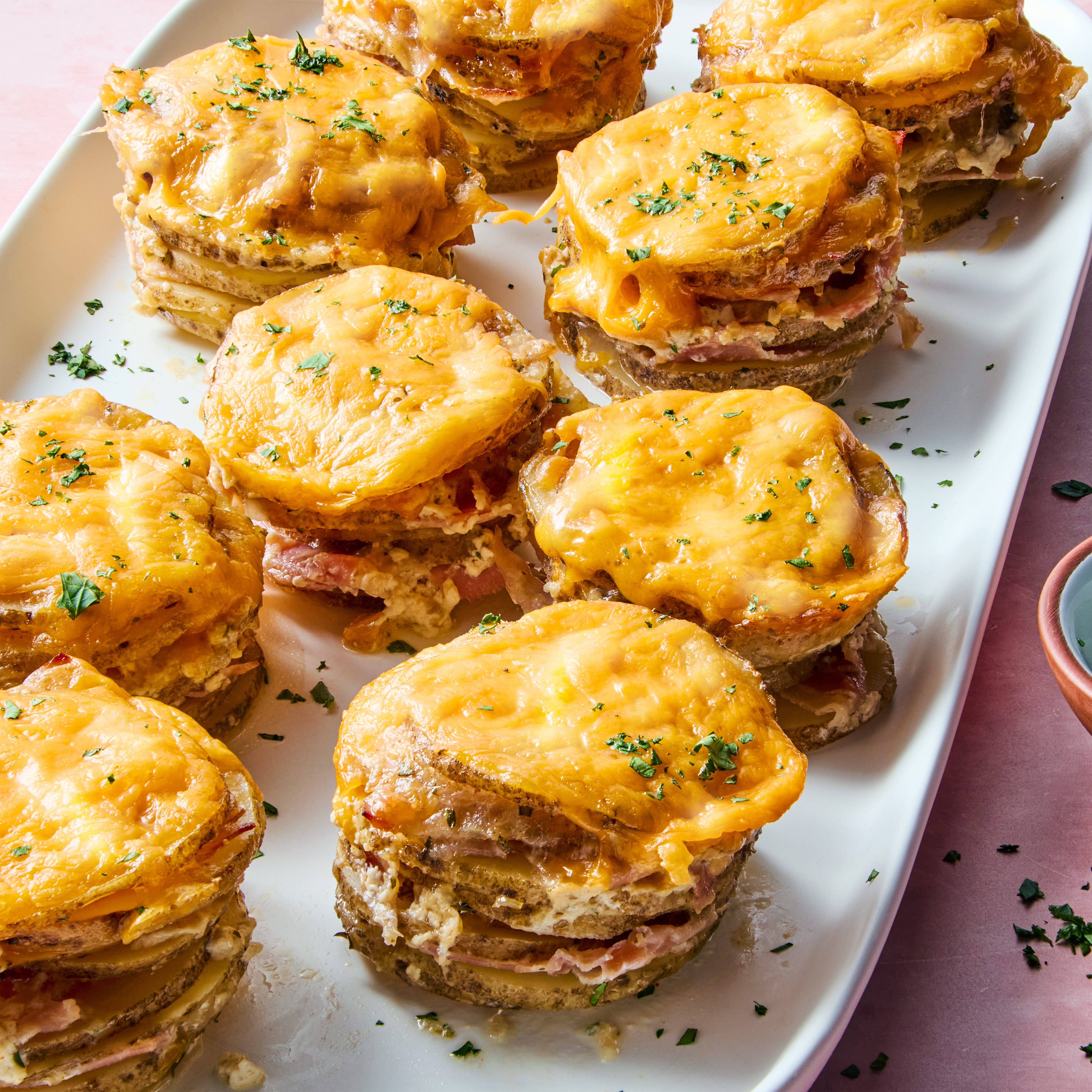 layers of russet potatoes soaked in fresh thyme, seasoned half and half, and parmesan layered thinly sliced ​​​​​​​​​​​​​​ham and topped each with melty cheddar cheese