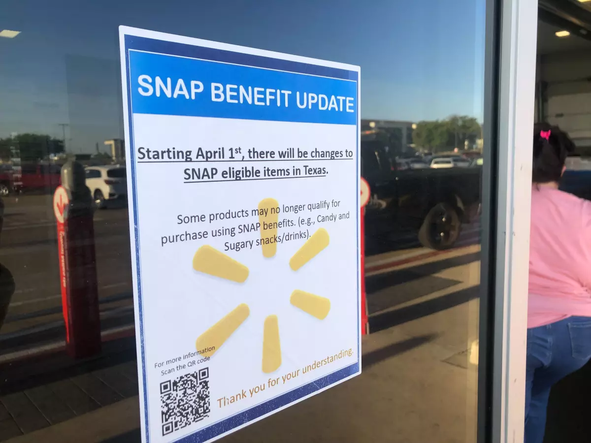 A sign outside Walmart that reads 'Update SNAP benefits: Starting April 1, there will be changes to SNAP eligible items in Texas.'