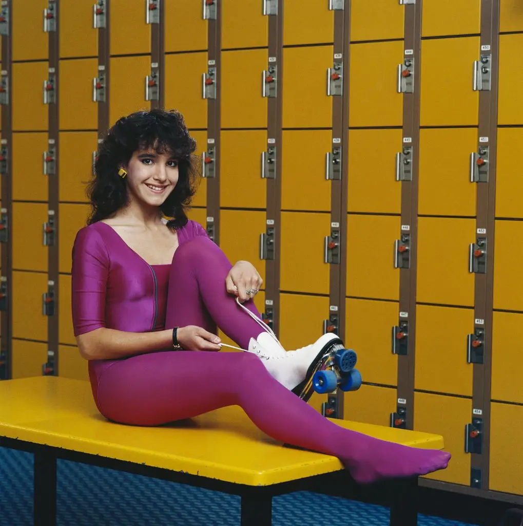 woman in a purple workout outfit 