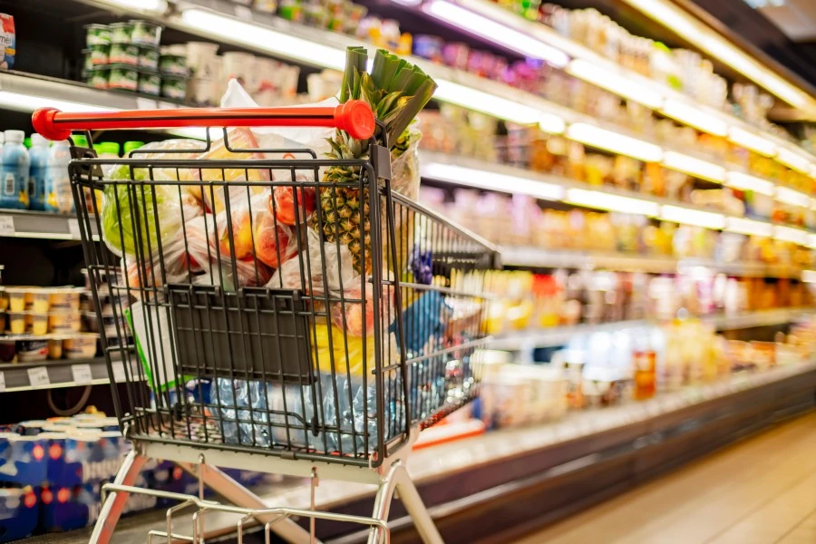 A shopping cart full of groceries.