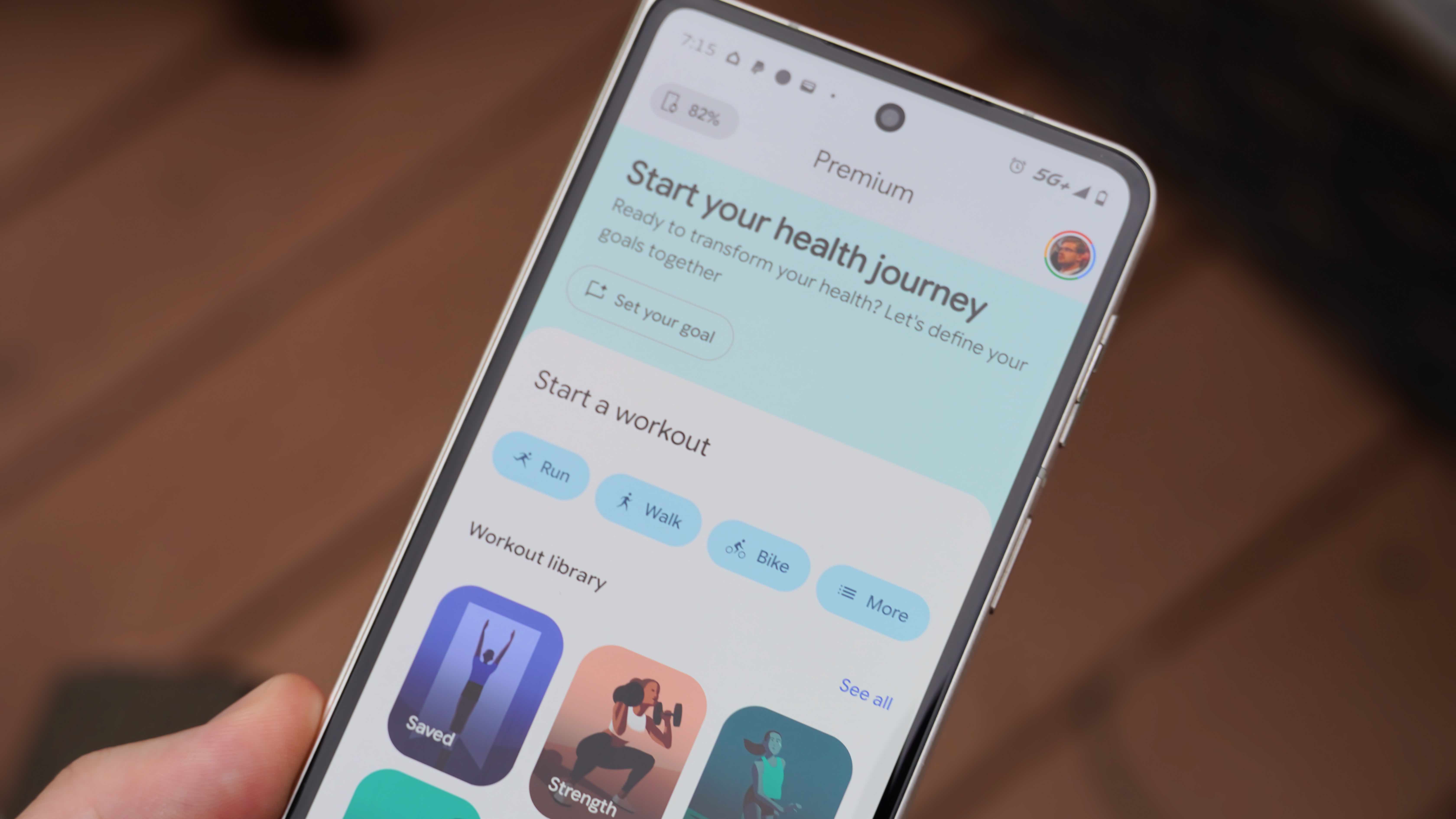Fitbit Air and Google Health app settings on the lavender band.