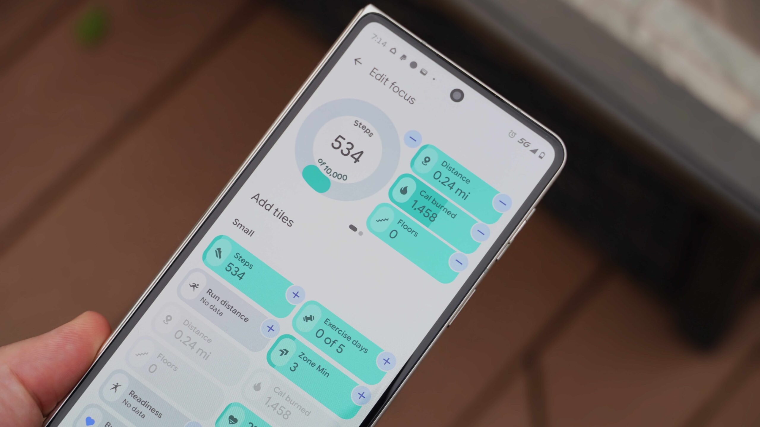 Fitbit Air and Google Health app settings on the lavender band.